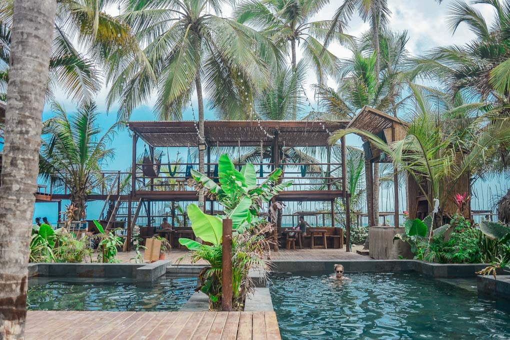 Bailey swims at Costeño Beach Hostel in Costena Beach, Colombia