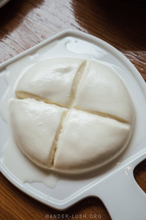 A round piece of homemade sulguni cheese.