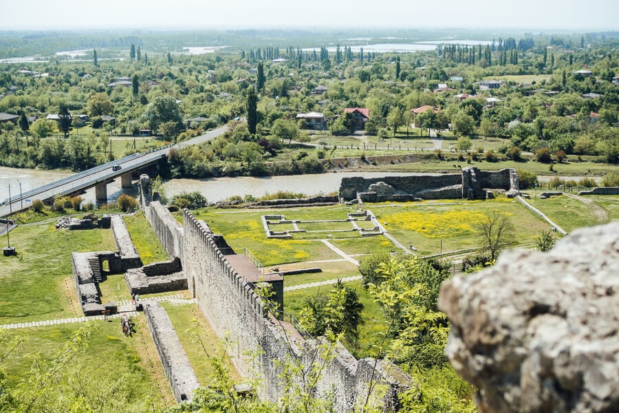 View of stone ruins and walls at Nokalakevi Fortress from the upper citadel.