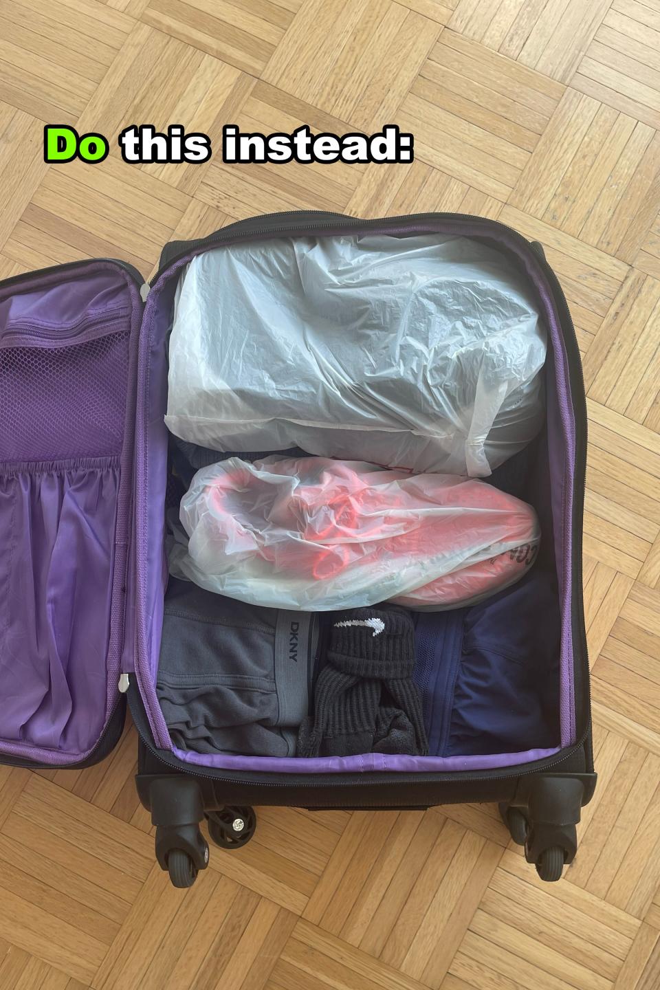 Open suitcase showing clothes packed neatly in clear plastic bags. Text reads: 