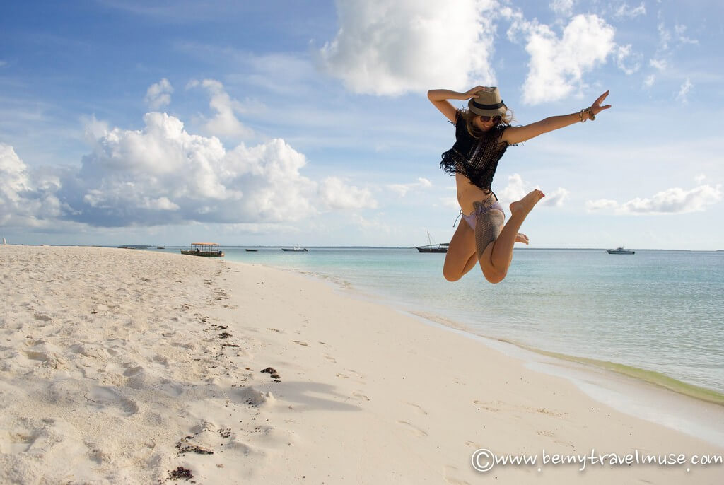 Jumping on a sandy beach in Zanzibar