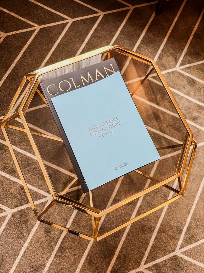 Elegant coffee table with Colman book in Sapphire House Antwerp room