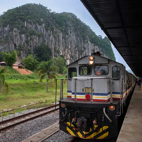 Marco Ferrarese Travellers can get off at Gua Musang station to explore the limestone rock formations (Credit: Marco Ferrarese)