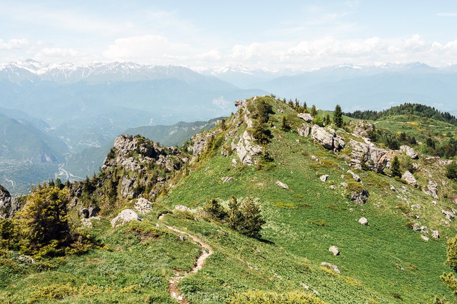 Green hills broken up with limestone rocks at the summit of Khvamli Mountain in Lechkhumi.