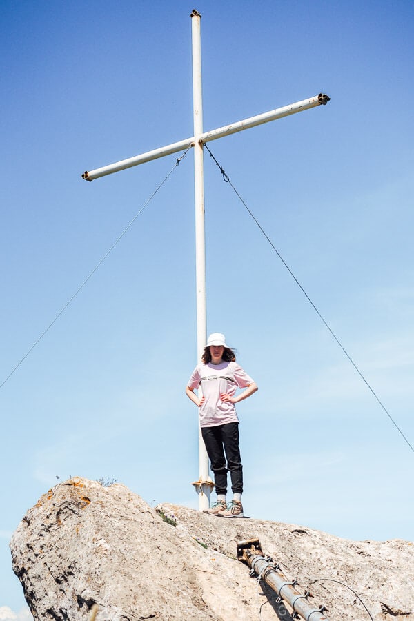 A woman standing at the peak of Mount Khvamli near Kutaisi.