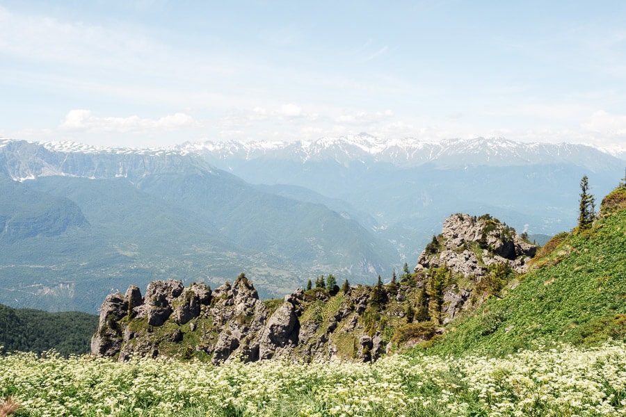 Limestone formations and a row of mountain peaks at the summit of Khvamli Mountain.