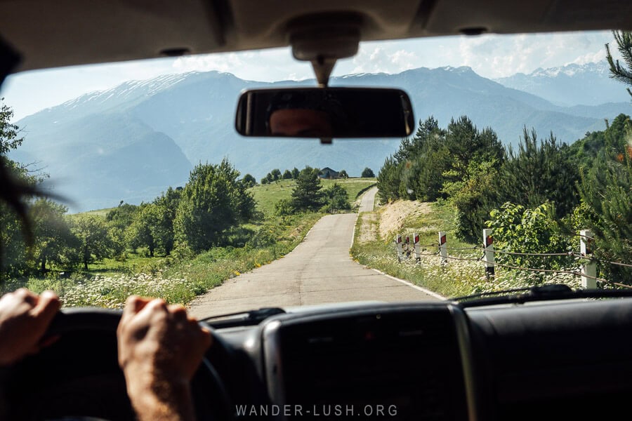 View of the road to Khvamli Mountain from Kutaisi from inside a car.