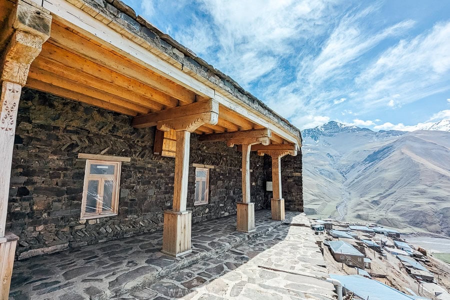 Khinaliq Mosque, a beautiful stone building with carved wooden beams that sits high on a plateau overlooking the village.