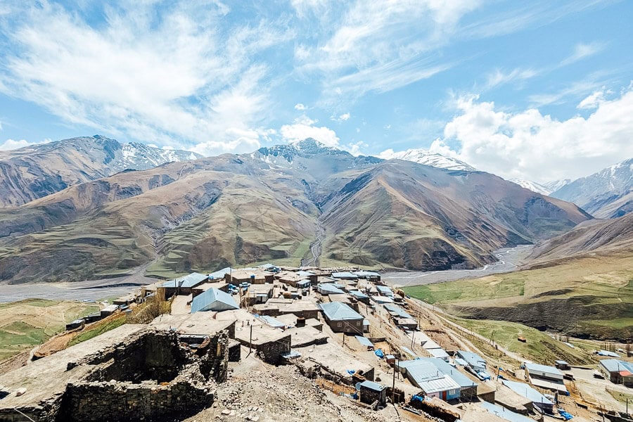 View of mountains and the tops of houses inside the UNESCO village of Khinaliq, Azerbaijan.