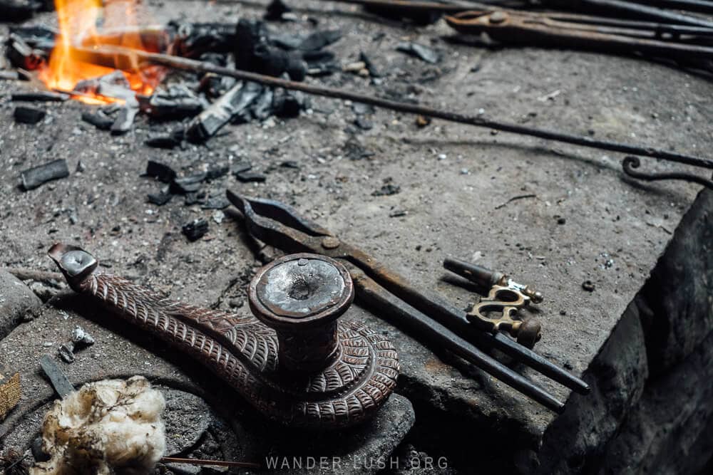 Metalsmith equipment sitting alongside a smelting fire in Lahic, Azerbaijan.