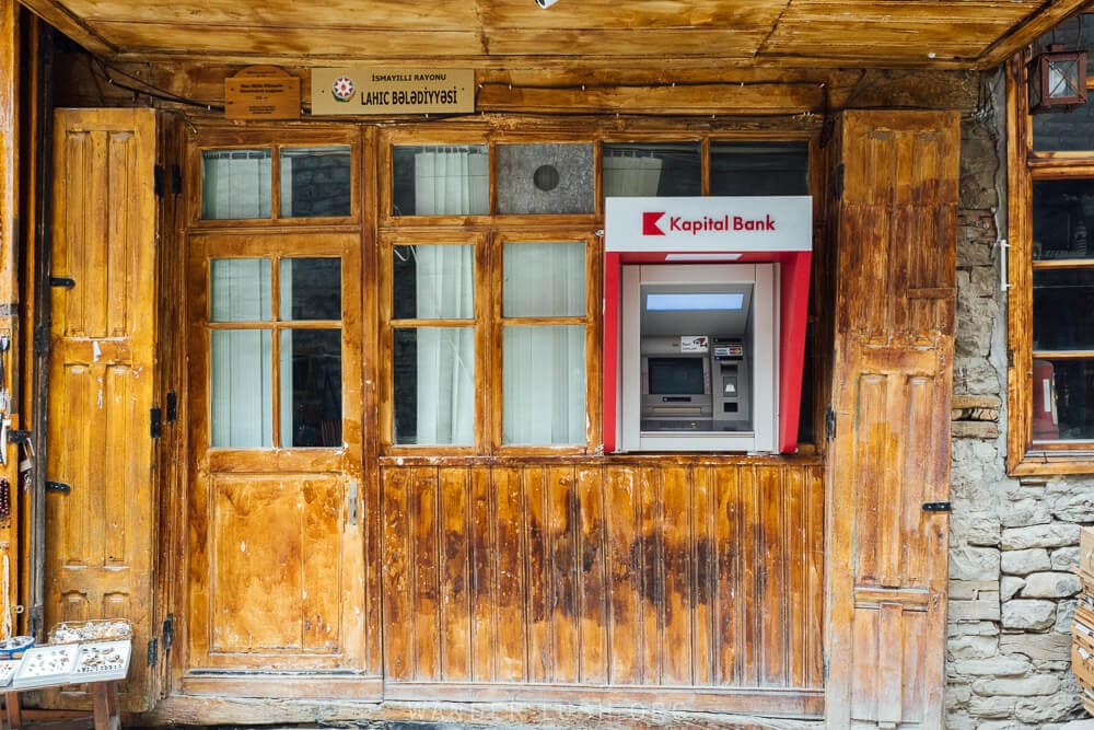 A red and white ATM cash machine in Lahic village, Azerbaijan.