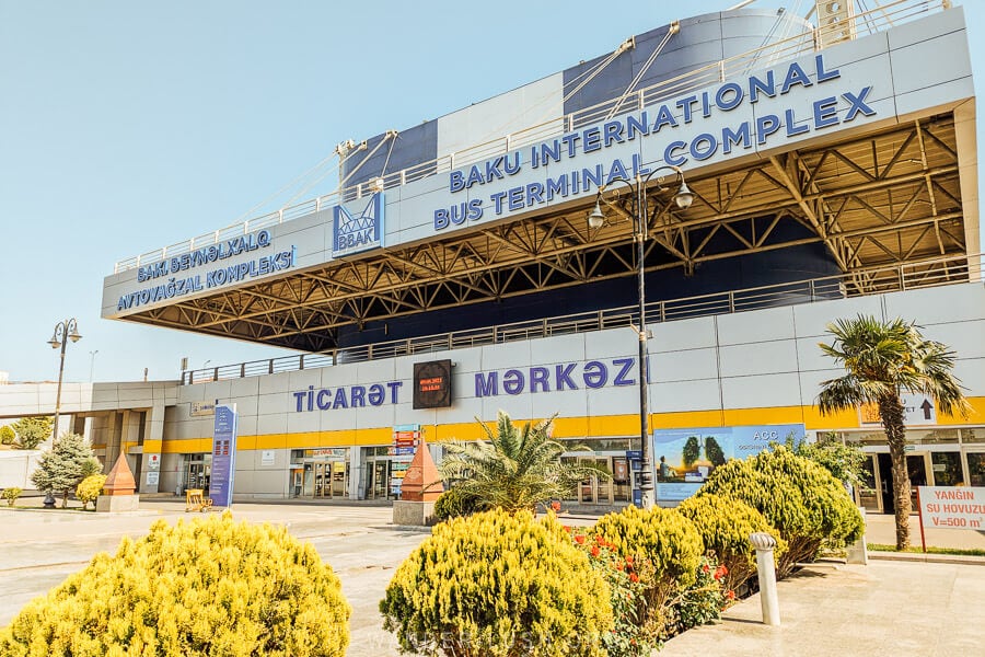 Baku International Bus Terminal, a modern bus station fringed by palm trees.