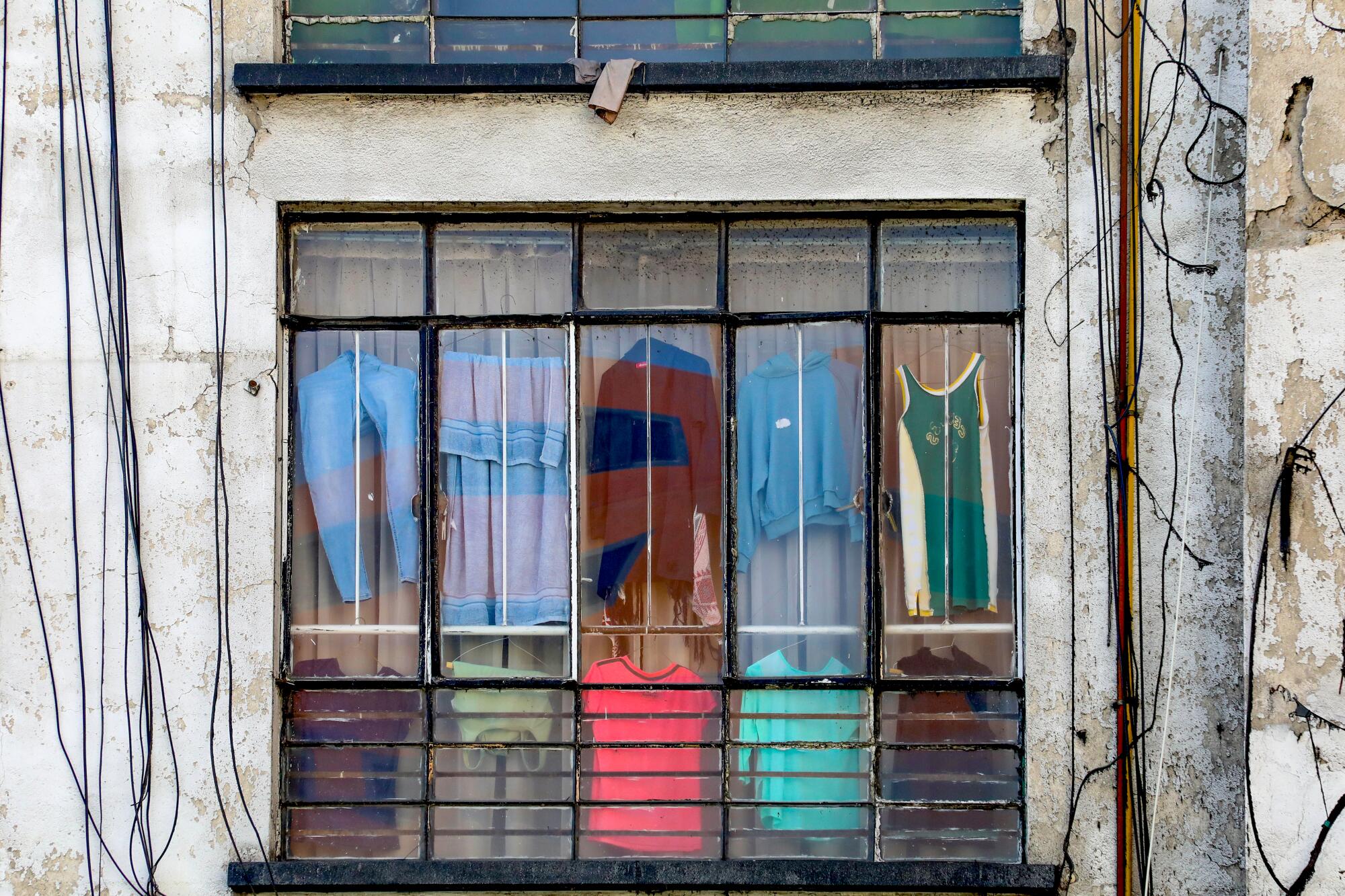 Large windows of an old building in Mexico City.