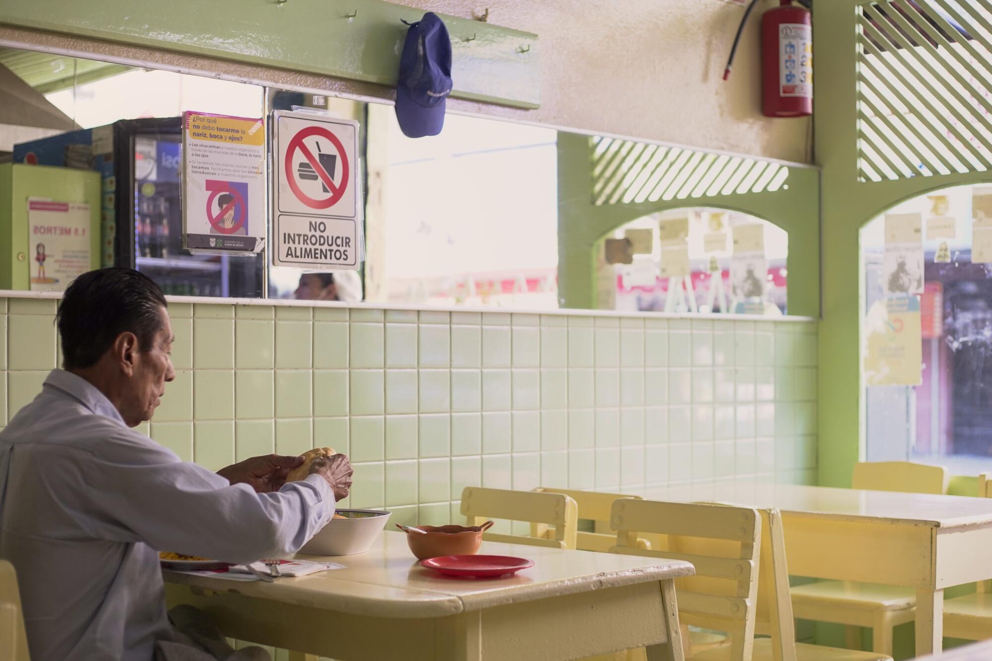 A diner seated in a restaurant 