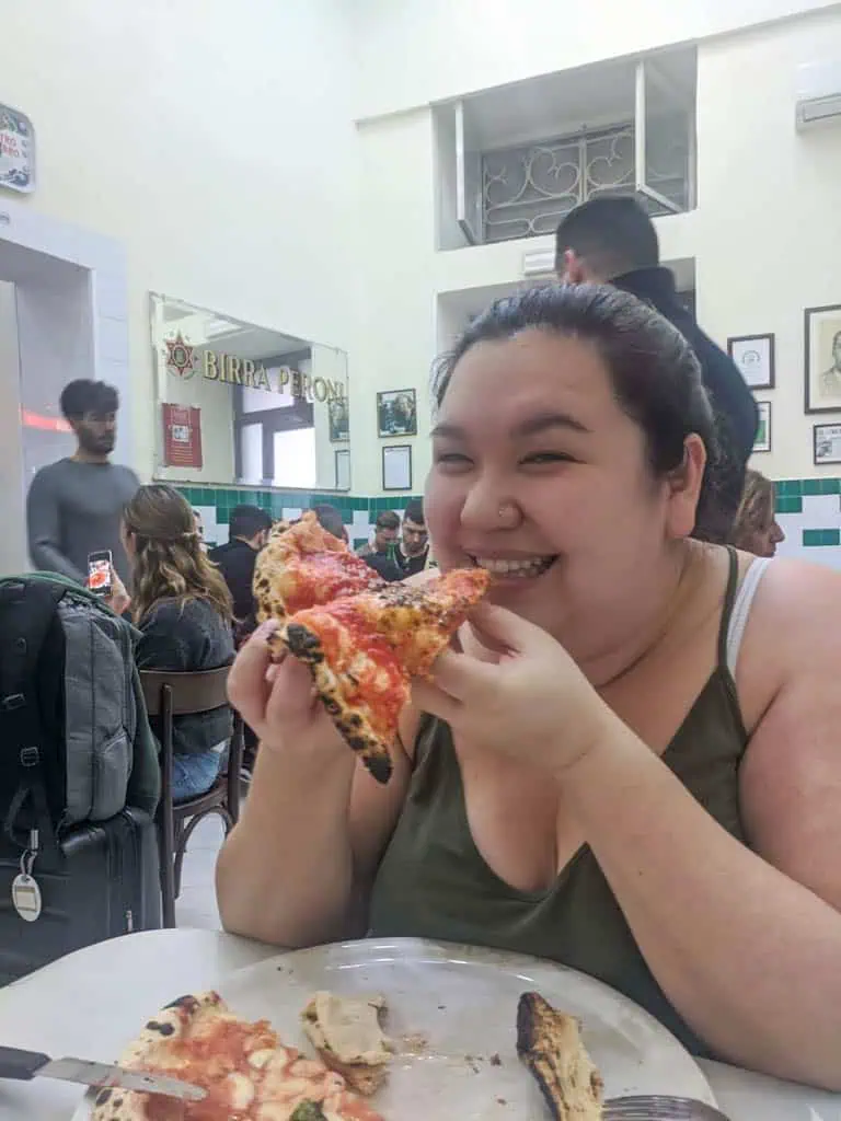 Eating pizza in Naples, Italy