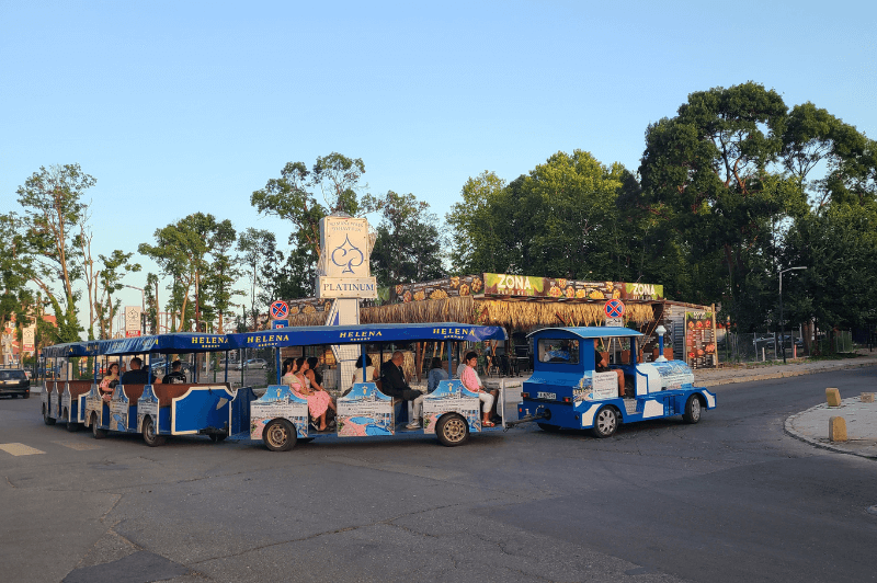 A tourist train drives by in Sunny Beach.