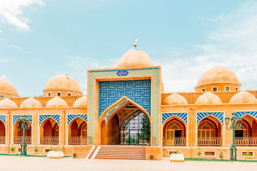 An ornate mausoleum decorated with blue tiles in Ganja, Azerbaijan.