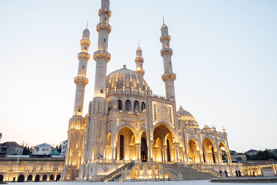 The Heydar Mosque in Baku lit up at night.