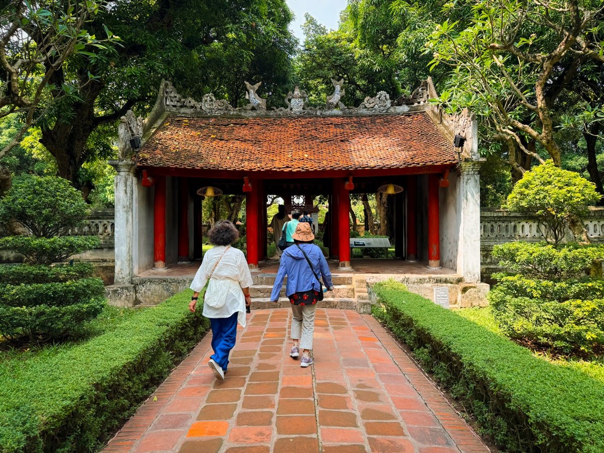 Tourists visiting the Temple of Literature in Hanoi, Vietnam.