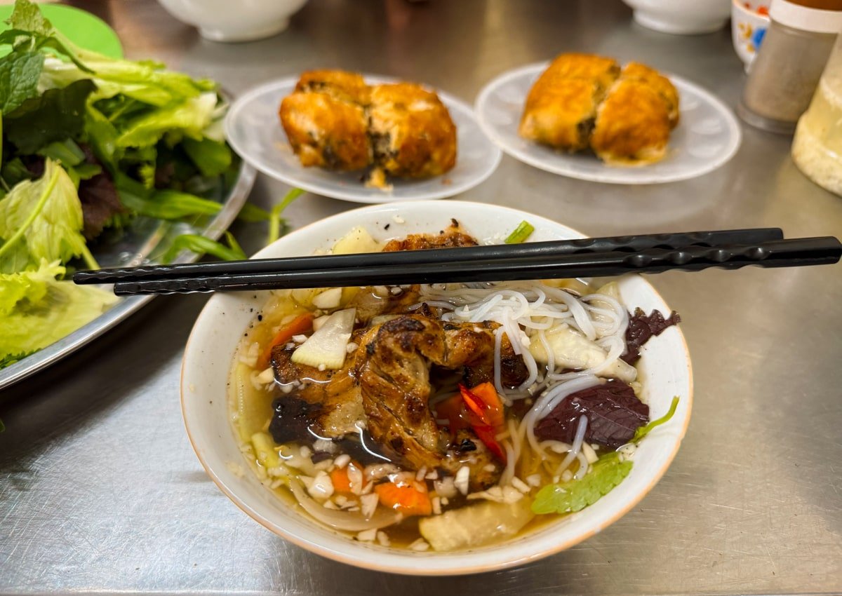 Bowl of Vietnamese bun cha—barbecued pork and meatballs with fermented rice noodles—in a local restaurant in Hanoi, Vietnam.