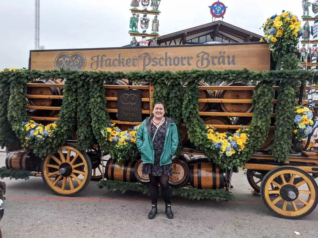 Riana posing in front of a beer cart at Oktoberfest