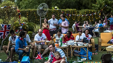 Getty Images British expats watch Queen Elizabeth II’s Diamond Jubilee anniversary in New Delhi. The 'typical' expat – often thought of as a Westerner – is changing (Credit: Getty Images)