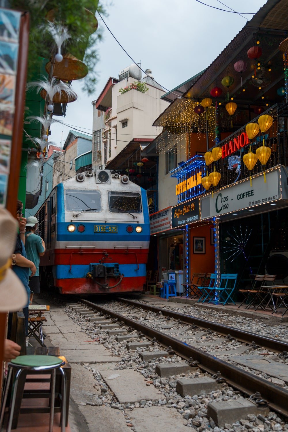 A train thundering down railroad tracks on narrow "Hanoi Train Street" cafes and shops just feet away.