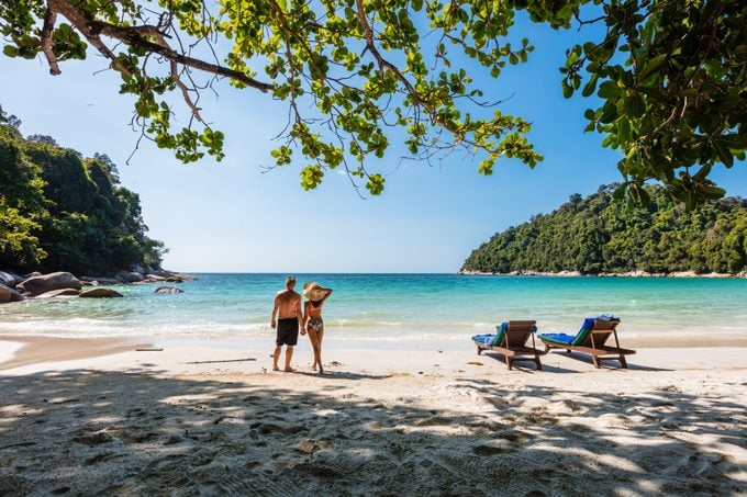 Tourist couple at the beach on a tropical island, Malaysia