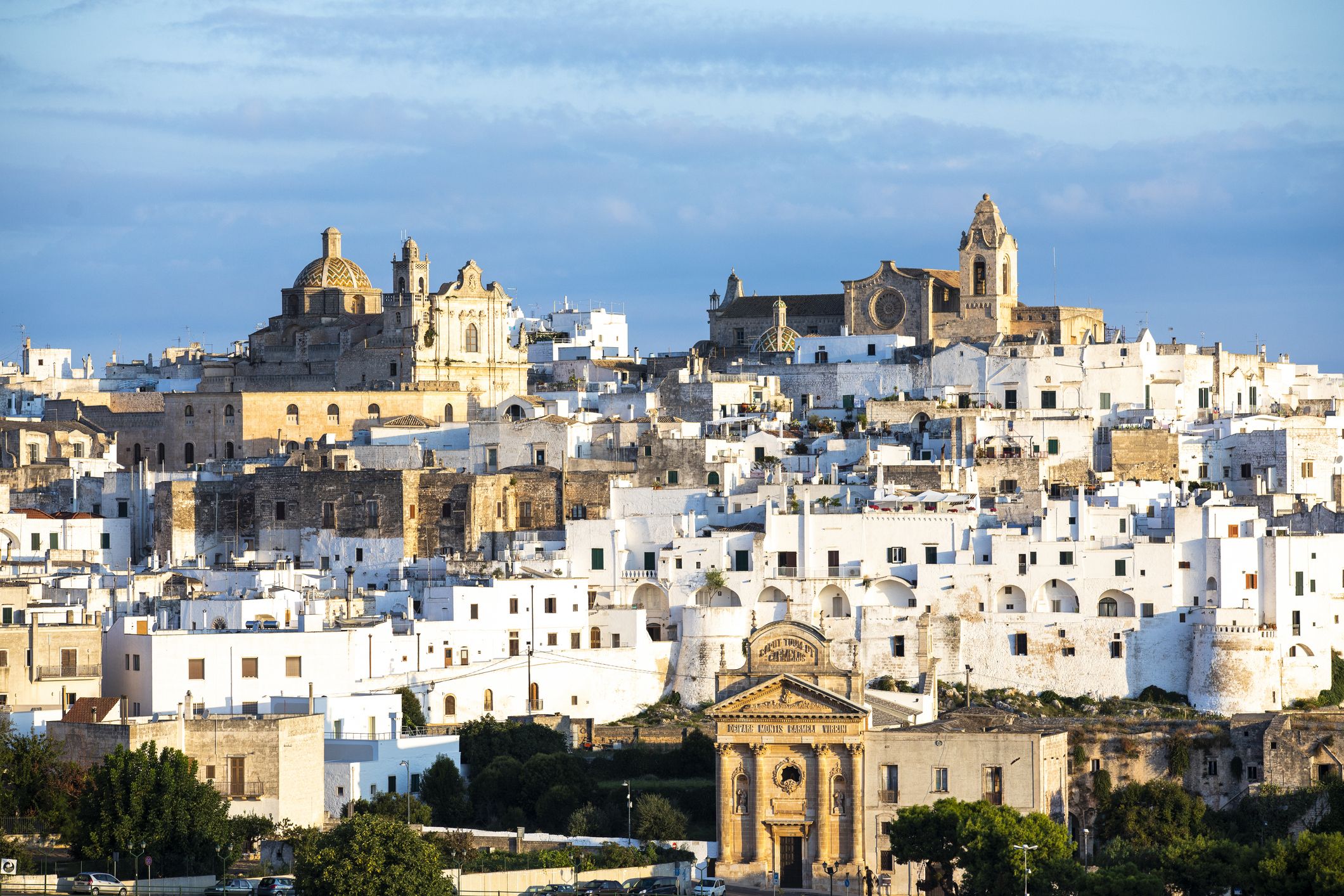 view of the city of ostuni during sunset, puglia , italy