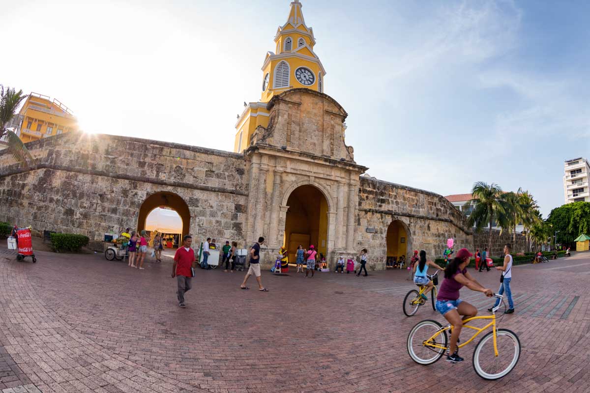 A lady rides a bike around Cartagena, Colombia