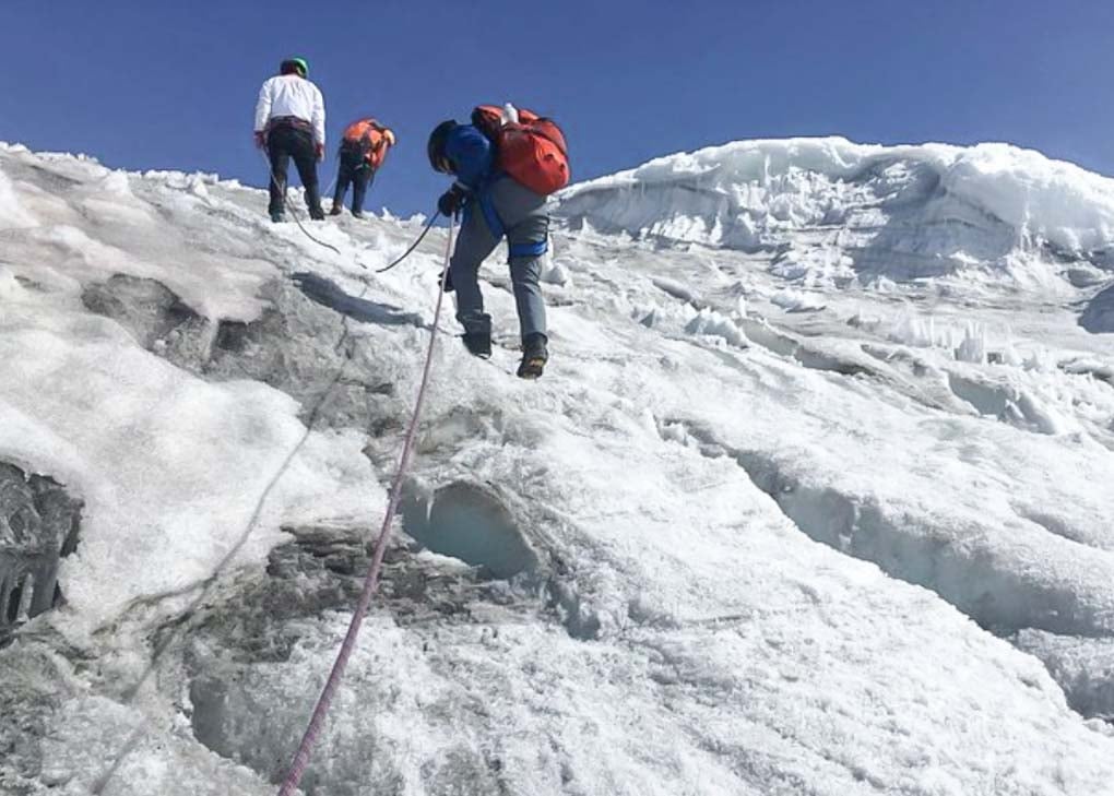 Climbers hike to Nevado del Tolima Summit near Salento, Colombia