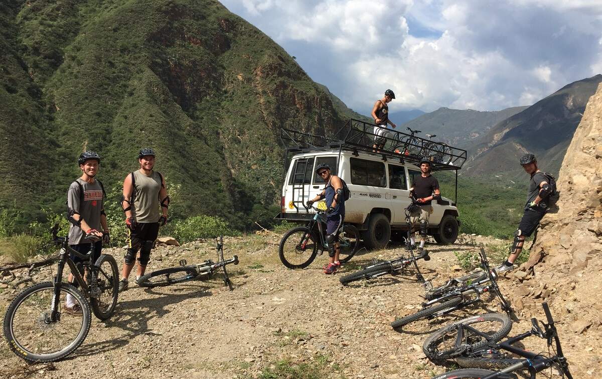 group of people on a mountain-side bike tour near San Gil