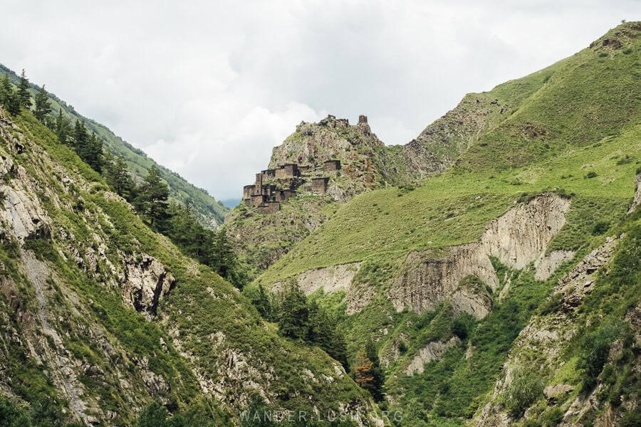 View of Mutso, a group of stone towers on a mountain between valleys in the Greater Caucasus mountains.