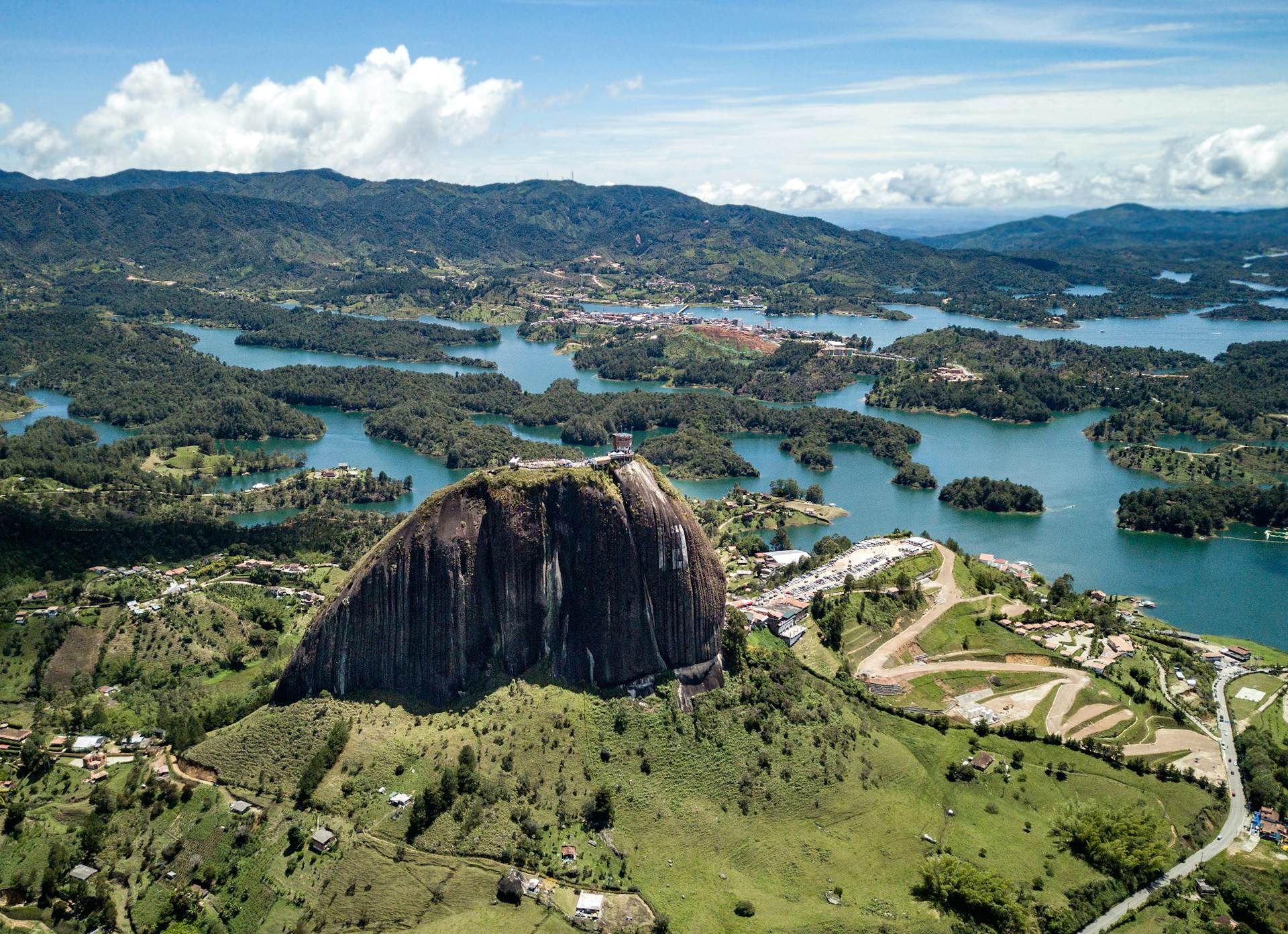 Aerial shot of a large granite outcrop on the edge of an extensive lake area with lots of islands