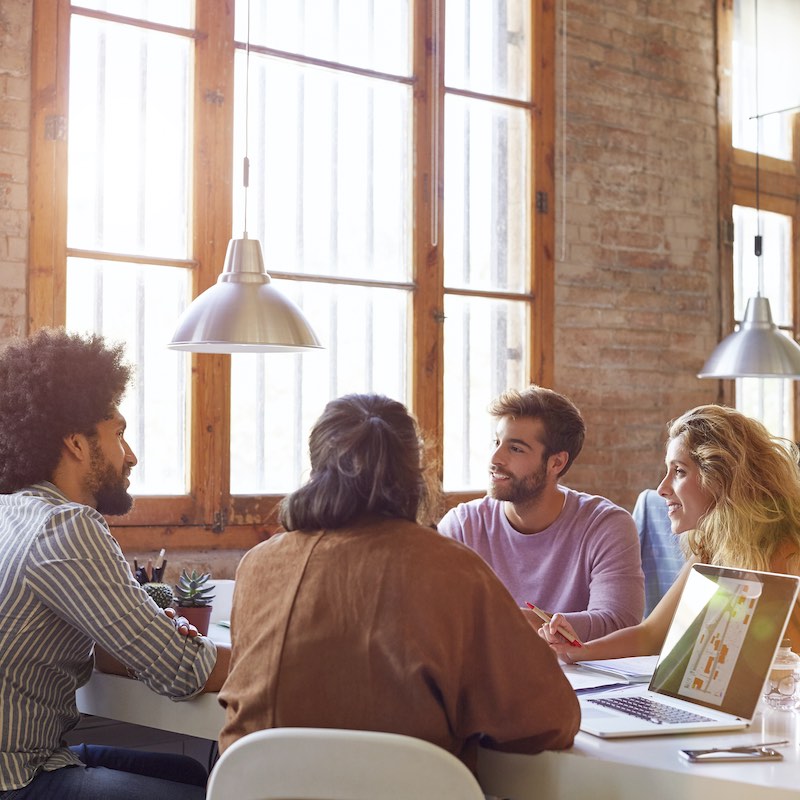 Professionals sitting at desk in office