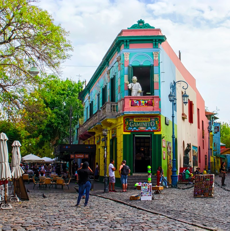 The main square on of the Camanito in the La Boca neighborhood of Buenos Aires features brightly colored buildings and cobblestone streets that are a popular tourist destination