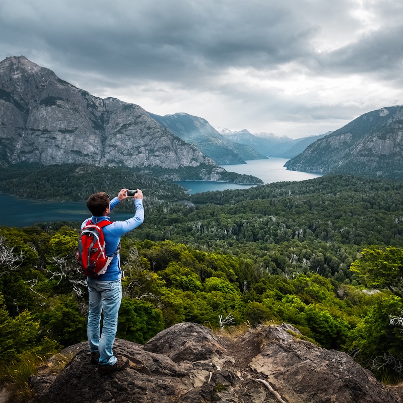 Hiker stands on top of the mountain