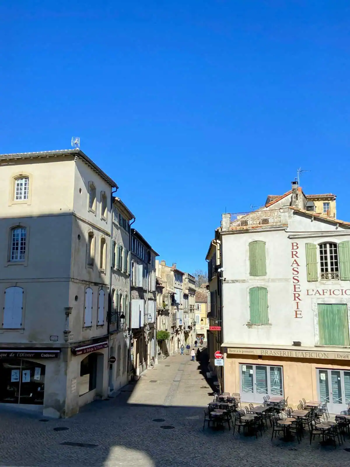 Cute street in Arles, Provence, France; should you visit Arles or Nimes?