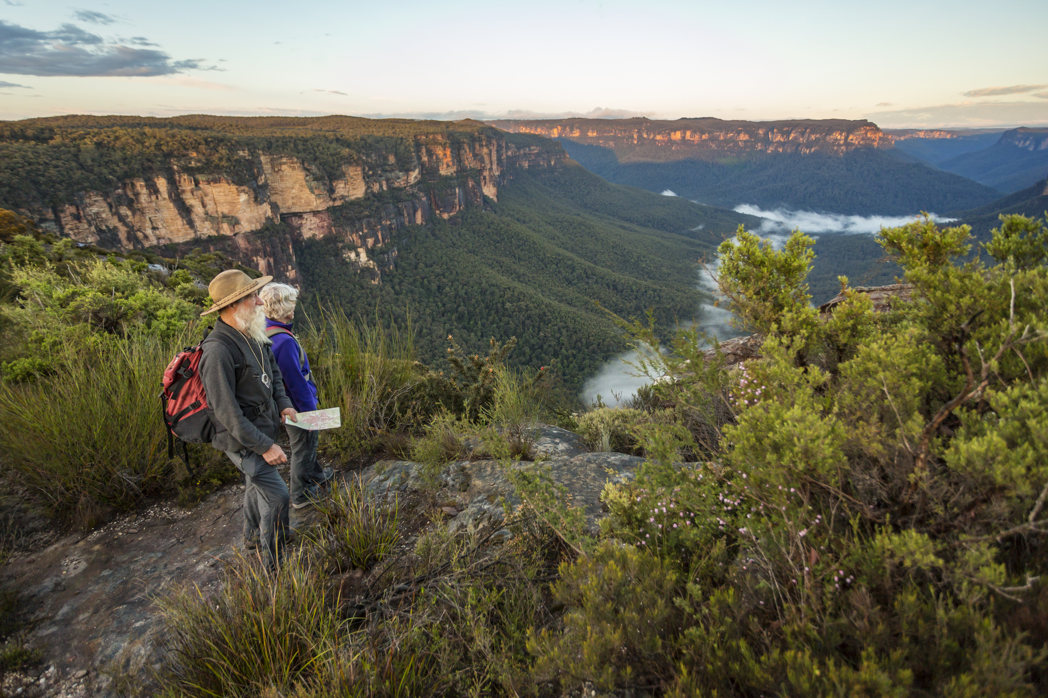 A senior couple looking at view while bushwalking in Australia