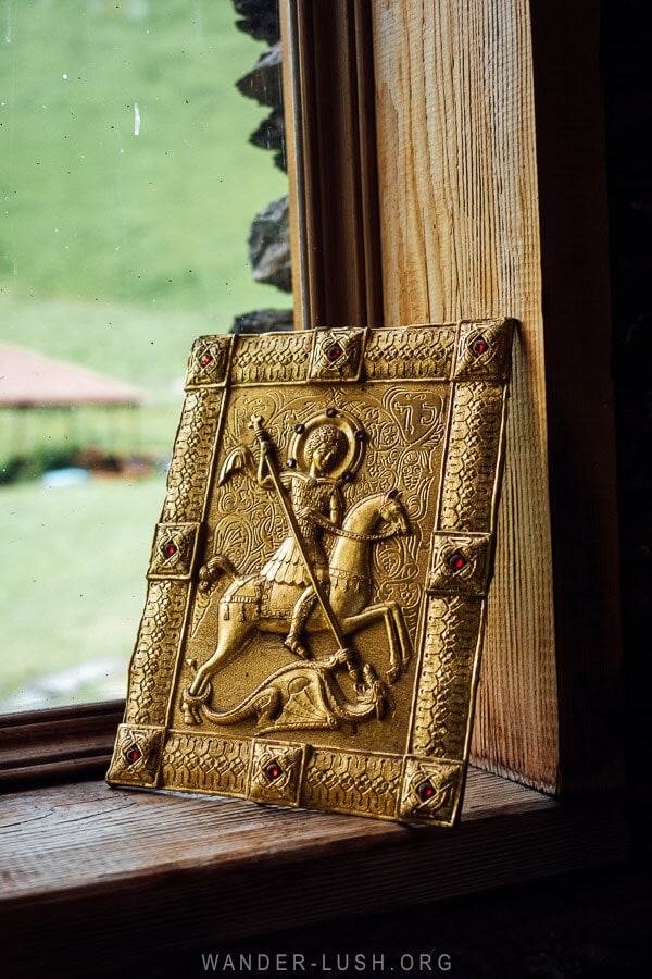 A golden St George icon propped on the window of Fifth Season.