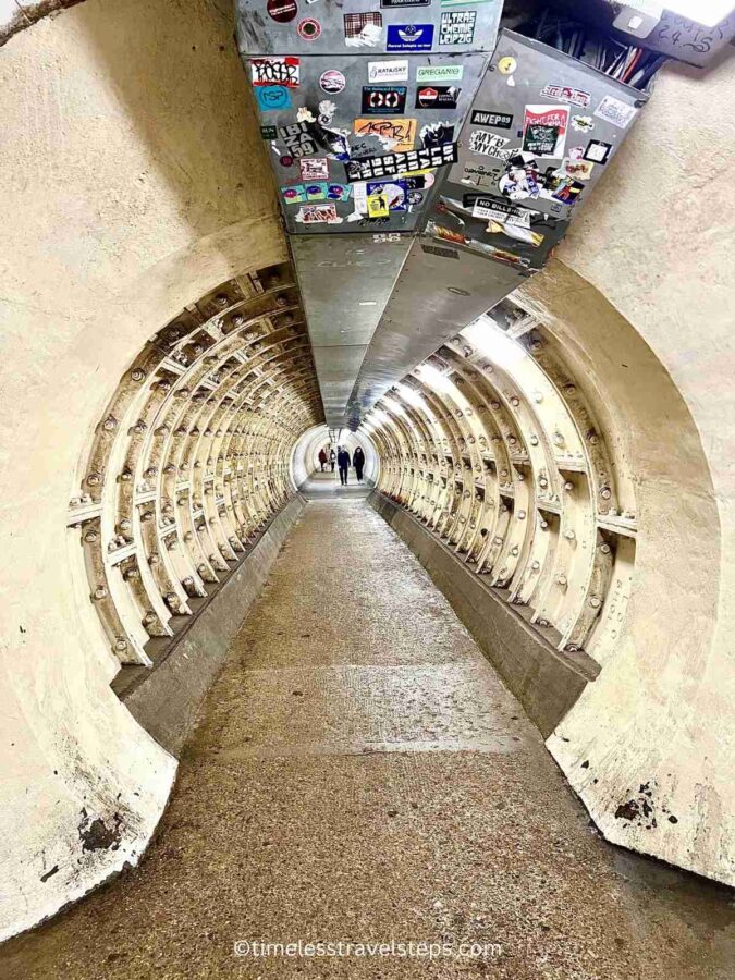 the beginning of the tunnel showcasing the metal casing of the Greenwich Foot Tunnel 