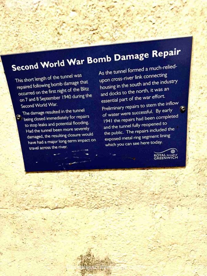 a signage on the wall of the tunnel that describes the spot where a bomb damaged the tunnel during WWII