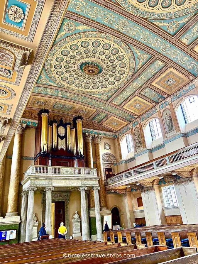 view of the entrance to the Chapel of St Peter and St Paul with the organ front on the upper floor and the beautiful ceiling in Wedgwood blue