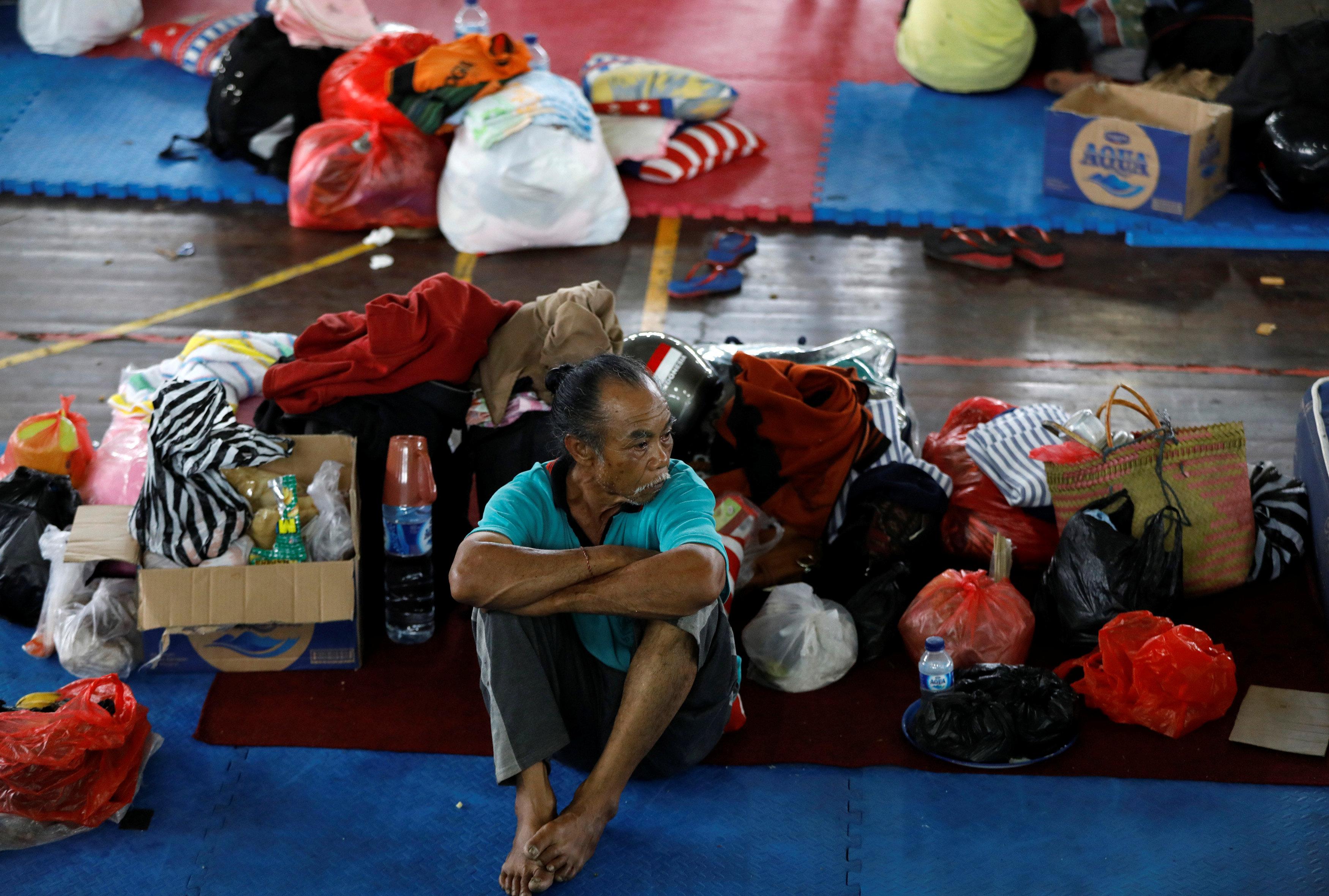  A man shelters in a rescue centre amid fears of an eruption