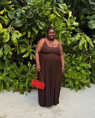 Woman wearing a brown summer dress.