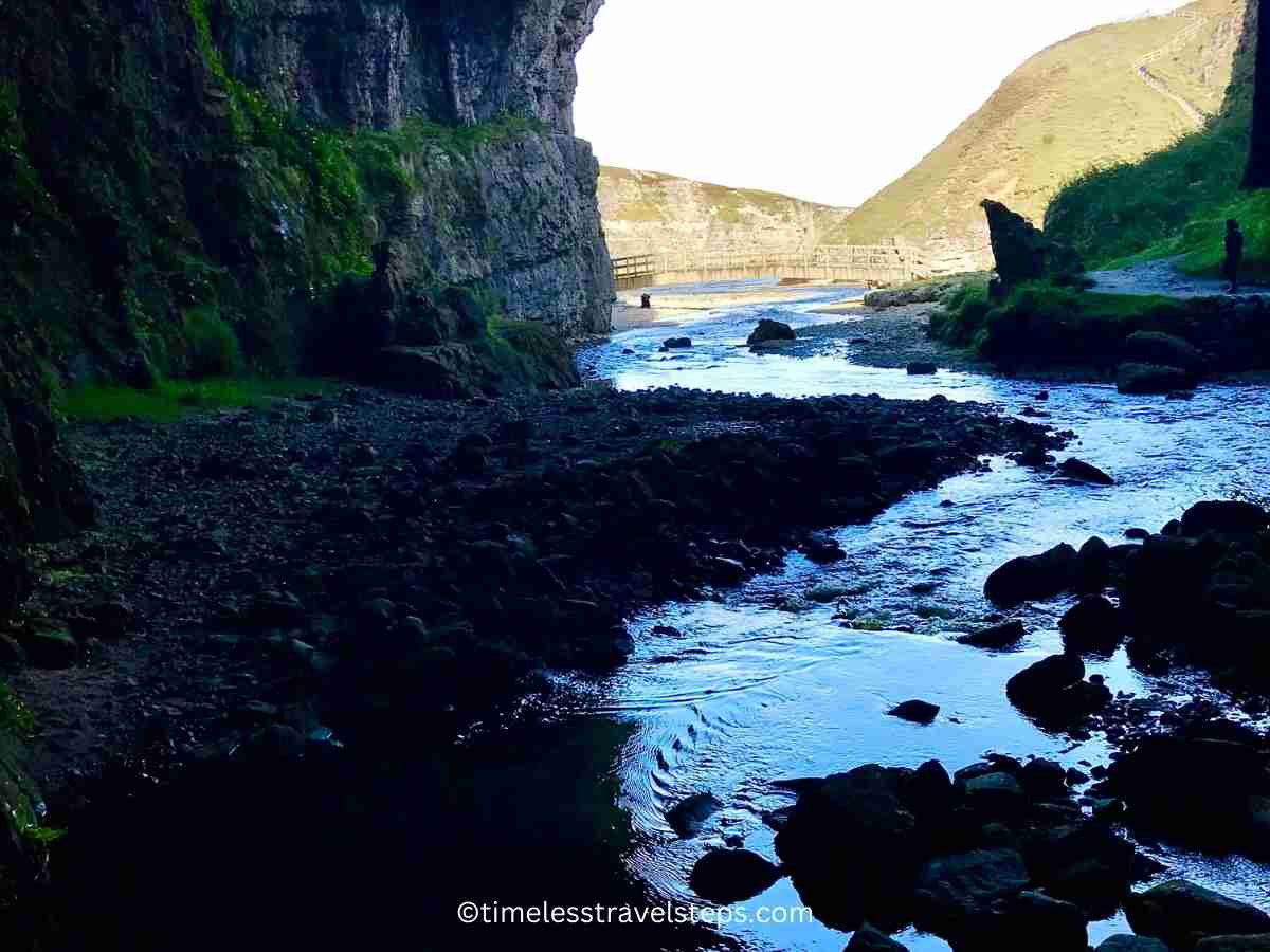 looking out from inside the cave