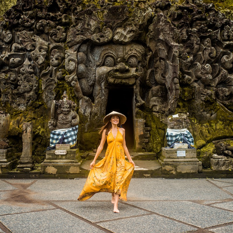 Beautiful Woman In Old Hindu Temple Of Goa, Gajah, Near Ubud On The Island Of Bali, Indonesia