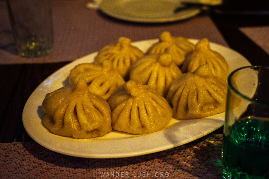 A plate of homemade khinkali dumplings at a Kazbegi restaurant, Lunch at Maia.