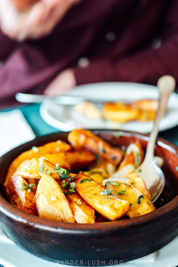 A clay dish of potatoes at a restaurant in Kazbegi, Georgia.