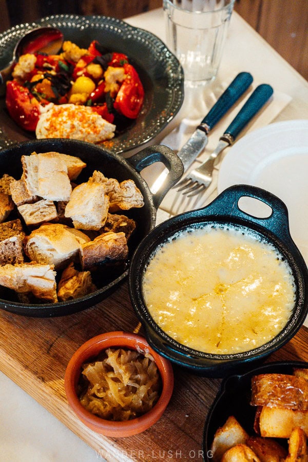 Kharchoerbo, a cheese fondue dish served with bread croutons and a salad at Maisi restaurant in Kazbegi, Georgia.